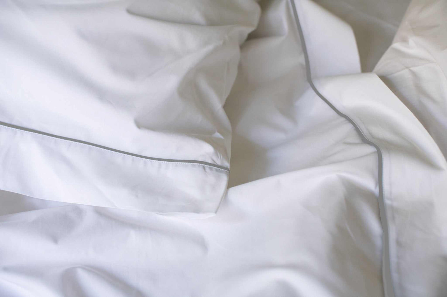 White cotton bedsheet set with grey piping design, soft and luxurious cotton piping design sheets