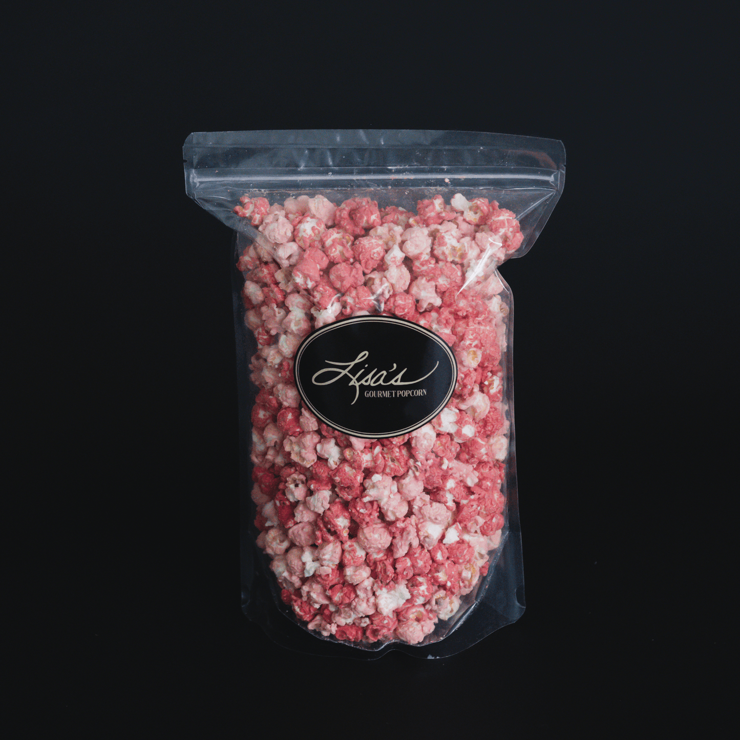 Raspberry Dream Popcorn in clear resealable bag with white chocolate and raspberry flavor blend