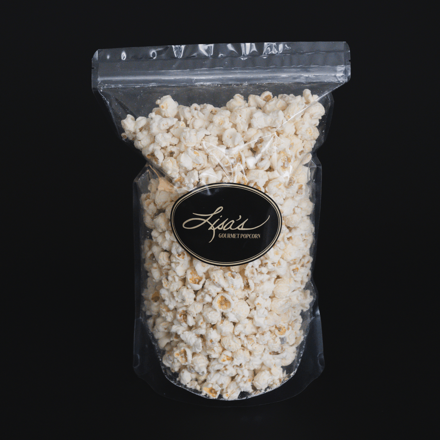 resealable bag of gourmet white chocolate popcorn with creamy coating against black background