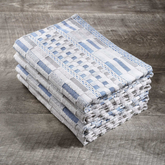 stack of blue and white organic cotton kitchen towels on wooden surface
