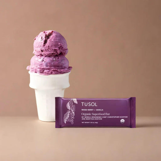 Maqui Berry + Vanilla organic protein bar by TUSOL with superfoods and clean ingredients next to berry-flavored ice cream in cone