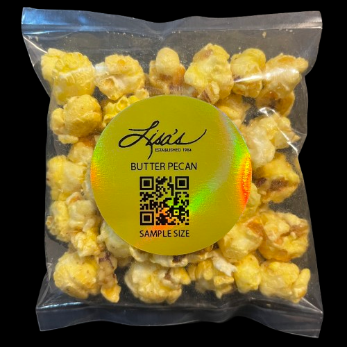 Clear package of Lisa's Butter Pecan Popcorn sample size with buttery popcorn and pecans visible