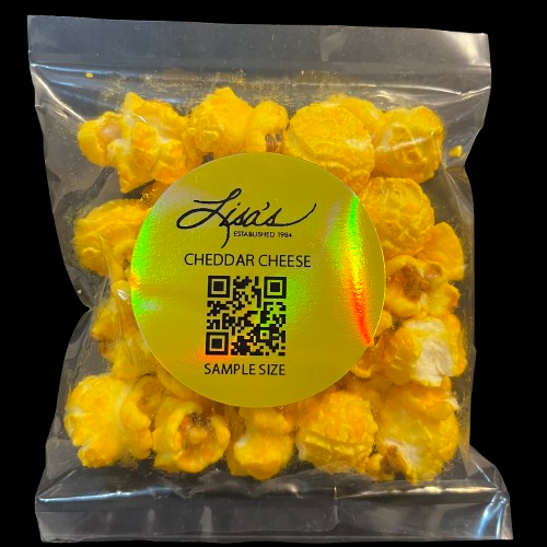 Sample size bag of Lisa's cheddar cheese popcorn with bright yellow cheese coating