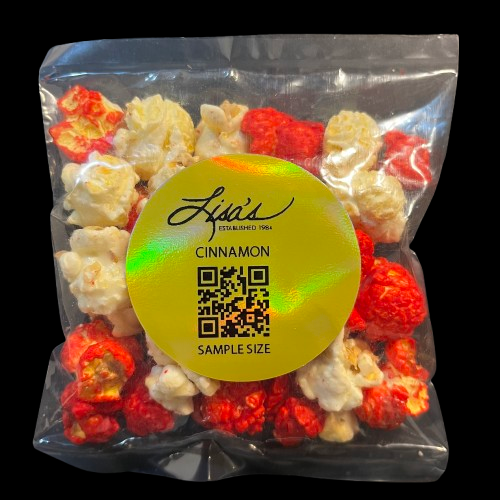 Sample size pack of Lisa's Cinnamon Popcorn with sweet and spicy glaze in red and white colors