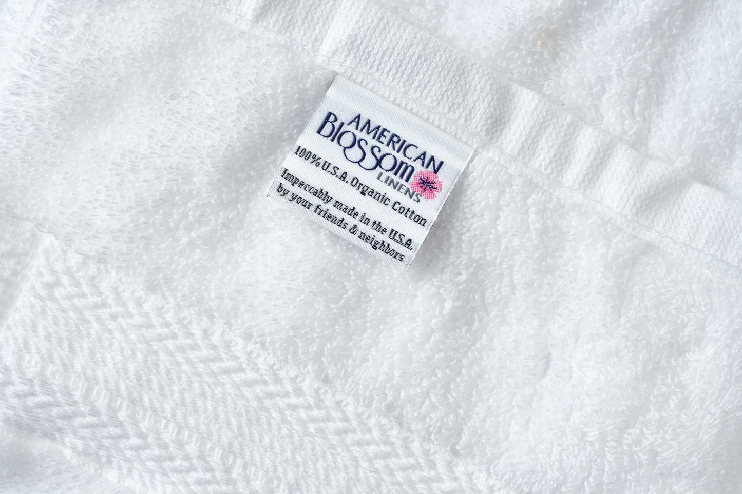 White luxury bathroom washcloth made of 100% USA organic cotton with premium softness and high absorbency