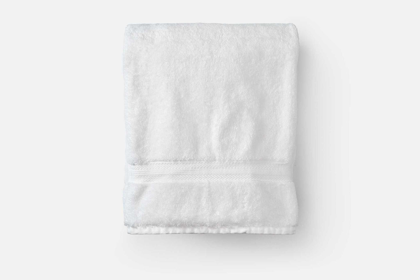 Soft white bath towel made of luxury USA cotton with 700 GSM for high absorbency and comfort