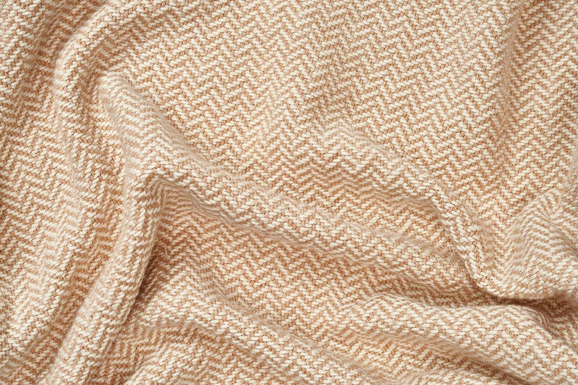 Soft beige herringbone weave cotton blanket with cozy texture for sofa or bed
