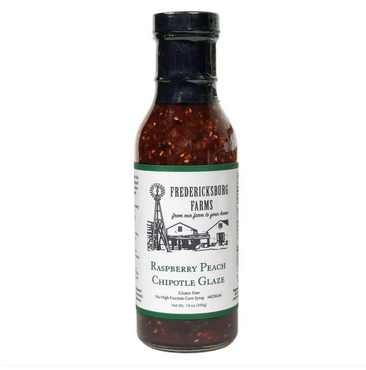 Bottle of Raspberry Peach Chipotle glaze for grilling chicken, pork, and burgers with a fruity smoky flavor.