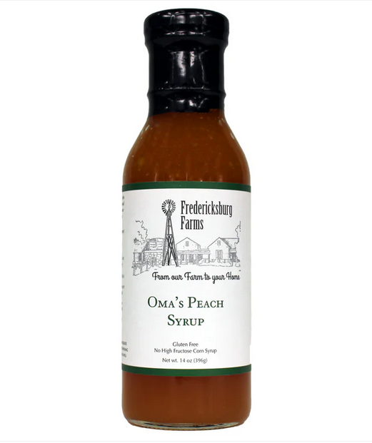 Bottle of Oma's Peach Syrup from Fredericksburg Farms for pancakes, waffles, and desserts
