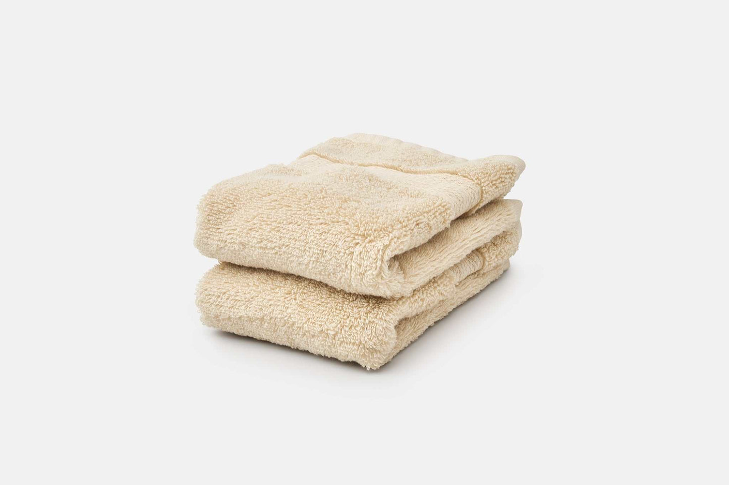 Premium USA cotton bathroom washcloths with 700 GSM softness and absorbency, stacked and neatly folded.