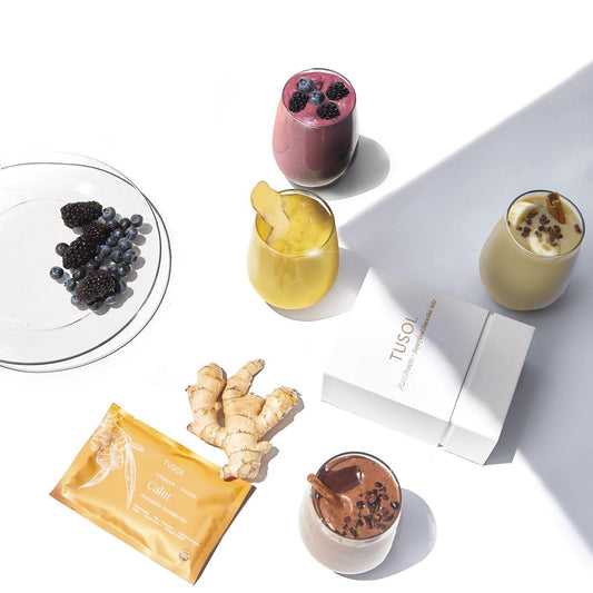 TUSOL Wellness Essentials Starter Kit with organic superfood smoothies, cacao latte, protein bars, and fresh ingredients