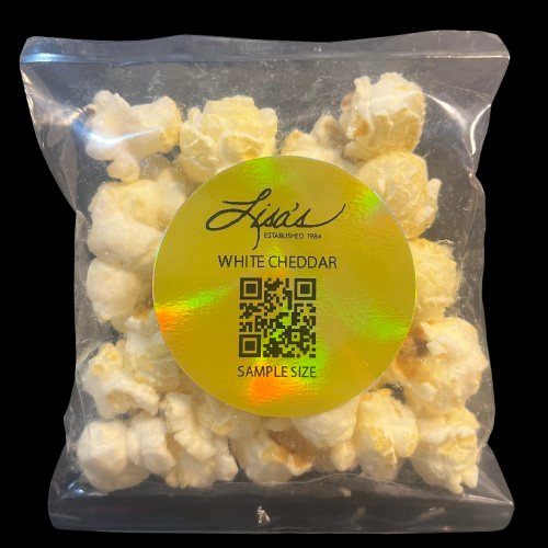 Sample size white cheddar popcorn in clear resealable bag with gold label and QR code