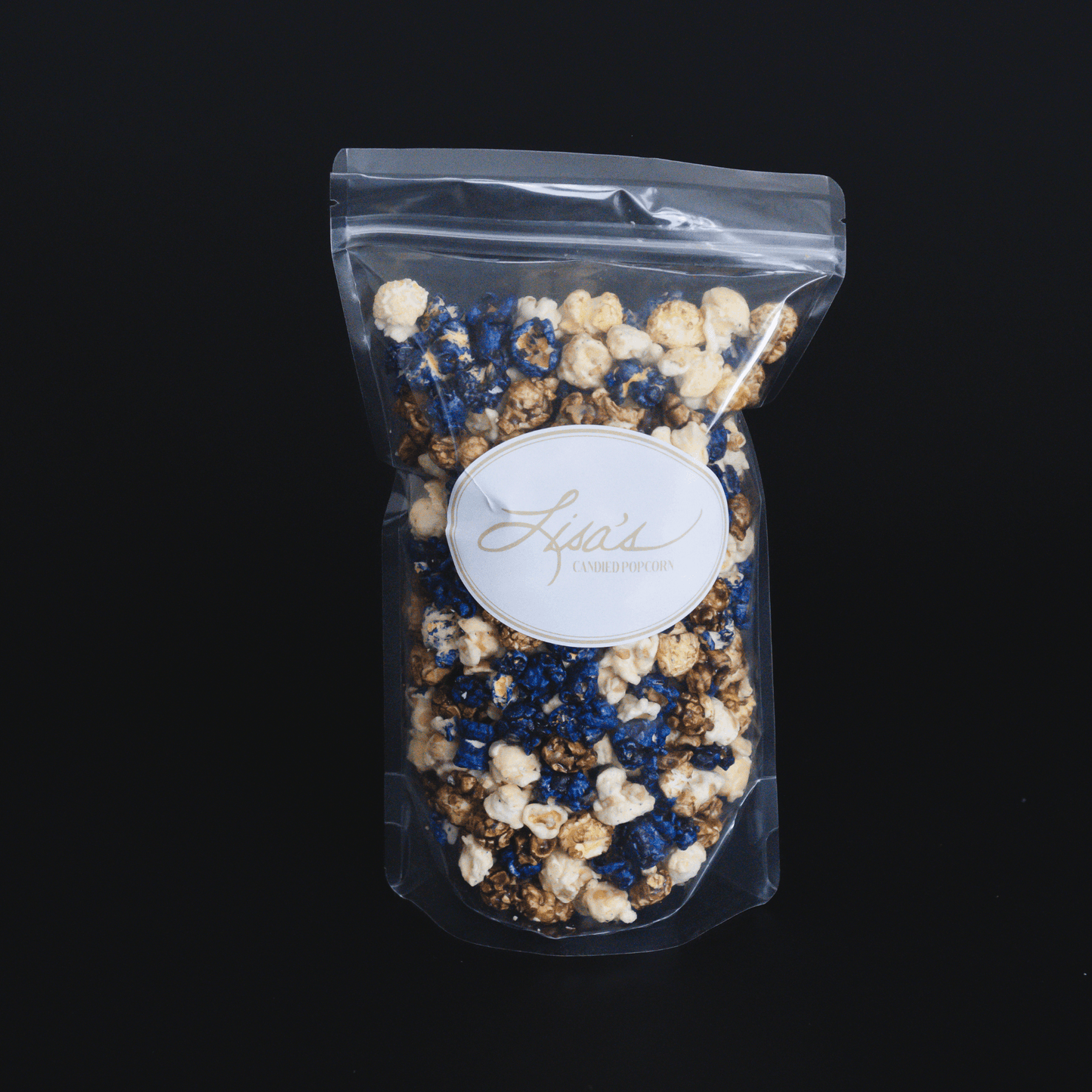 Blueberry muffin popcorn snack in clear resealable bag with blue and white coated popcorn pieces