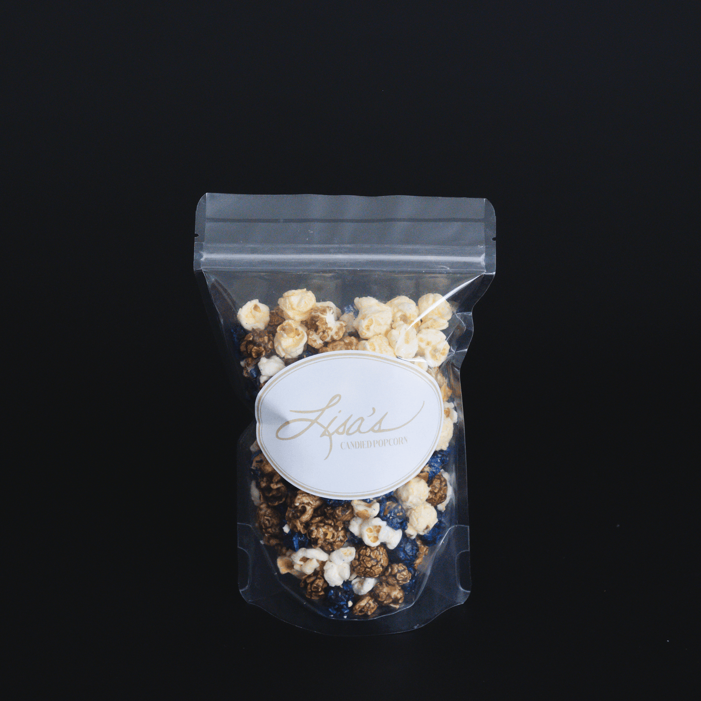 Blueberry muffin popcorn mix with candied sweet dough blueberry and buttery vanilla popcorn in clear resealable bag
