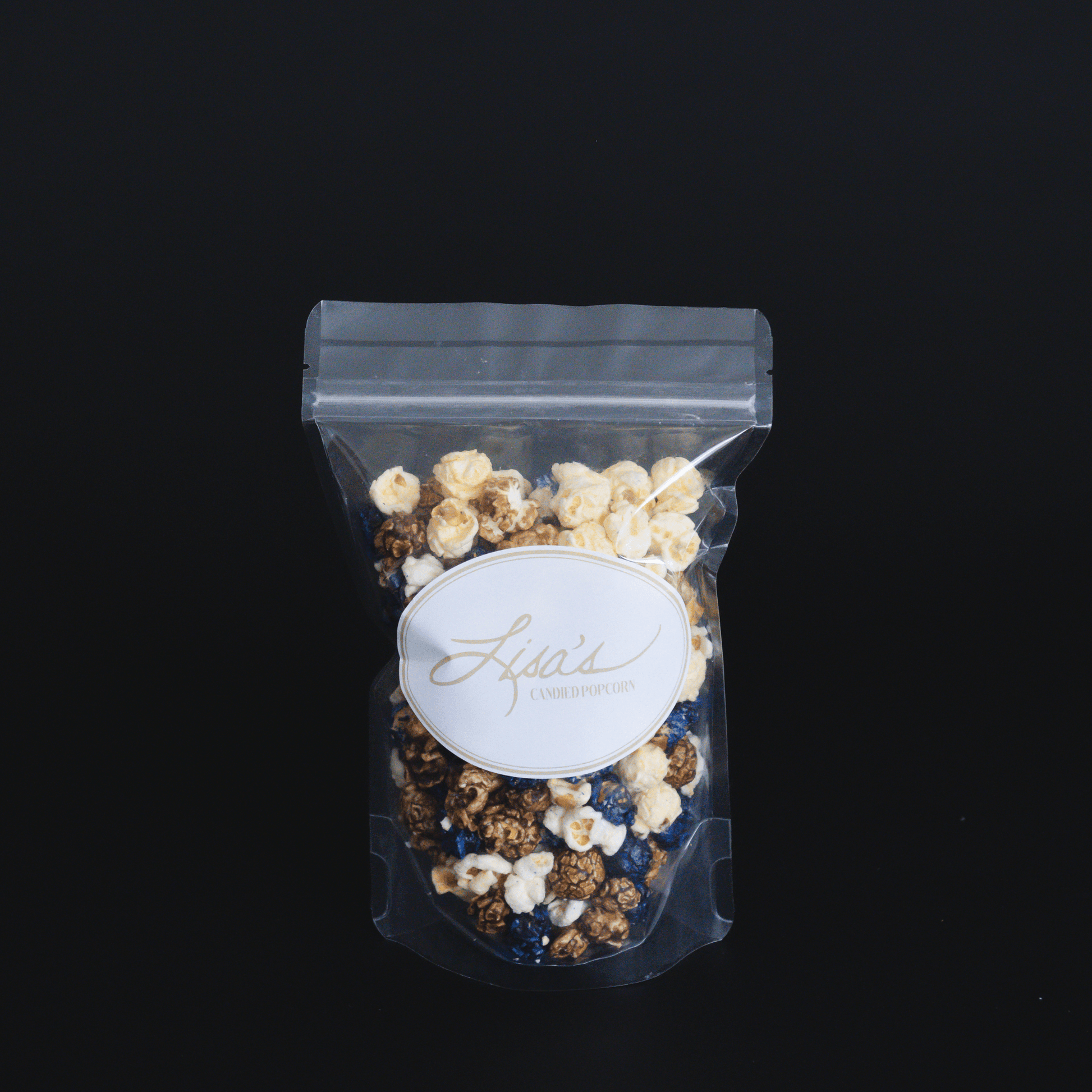 Blueberry muffin popcorn mix with candied sweet dough blueberry and buttery vanilla popcorn in clear resealable bag