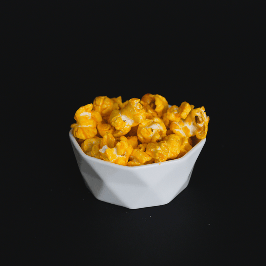 bowl of cheddar cheese popcorn snack with real cheddar cheese and salt