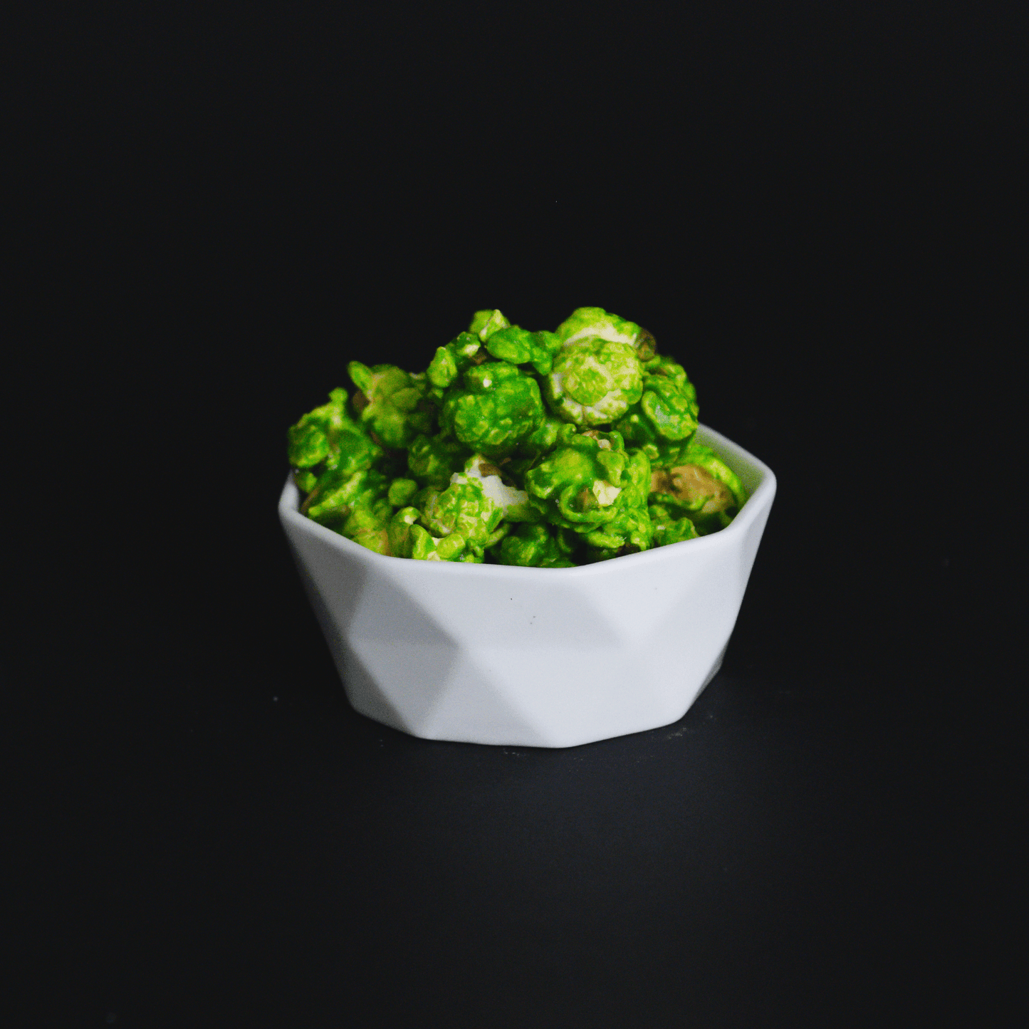 Mountain Mist Popcorn bowl with green candied lemon lime fizzy flavored popcorn snack