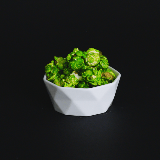 Mountain Mist Popcorn bowl with green candied lemon lime fizzy flavored popcorn snack