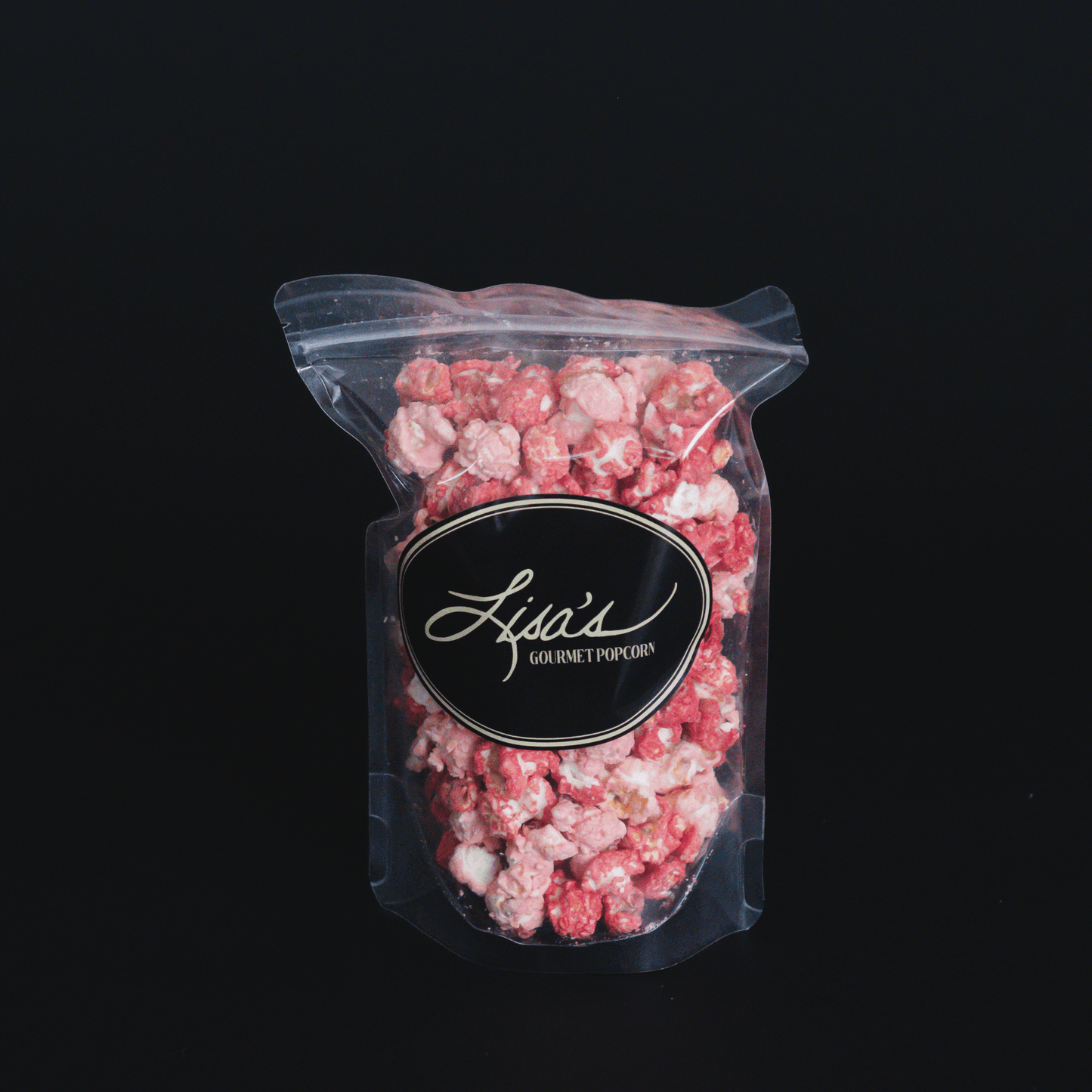 Resealable bag of Raspberry Dream Popcorn with white chocolate and raspberry flavor blend