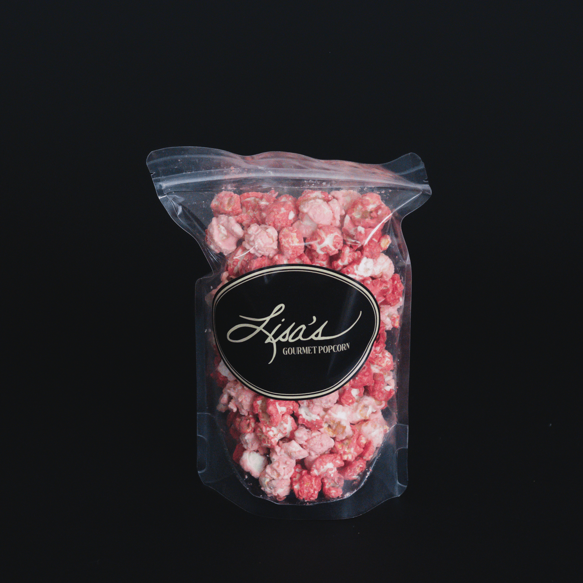Resealable bag of Raspberry Dream Popcorn with white chocolate and raspberry flavor blend